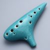 Ceramic ocarina musical instrument on a clean background